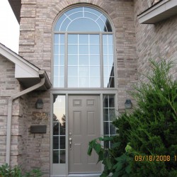 Door with sidelights with large round window above