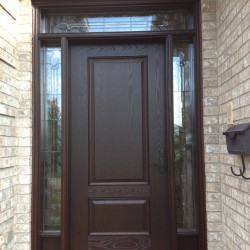 Fiberglass door with decorative sidelight glass and transom