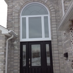 Fiberglass door with round top windows above