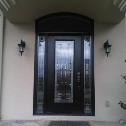 Steel door with segmental transom